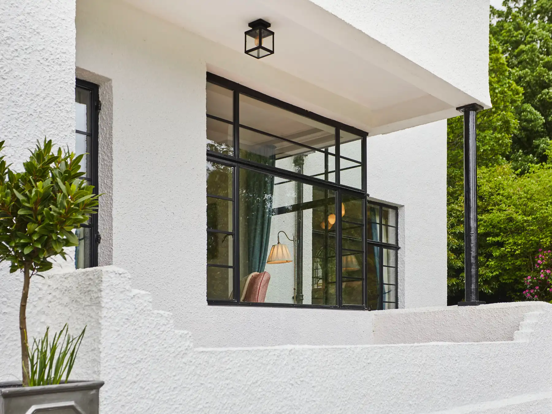 Crittall approved installer fitting bespoke steel glazing in Keswick